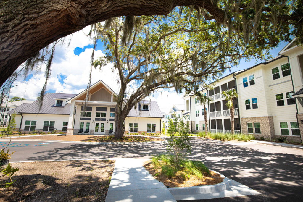 outdoor view of property buildings near large trees