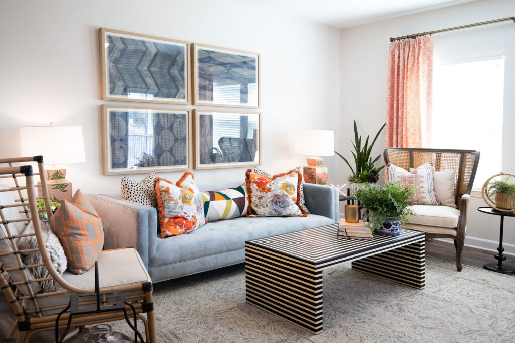 living room with couch, wall art, and decor