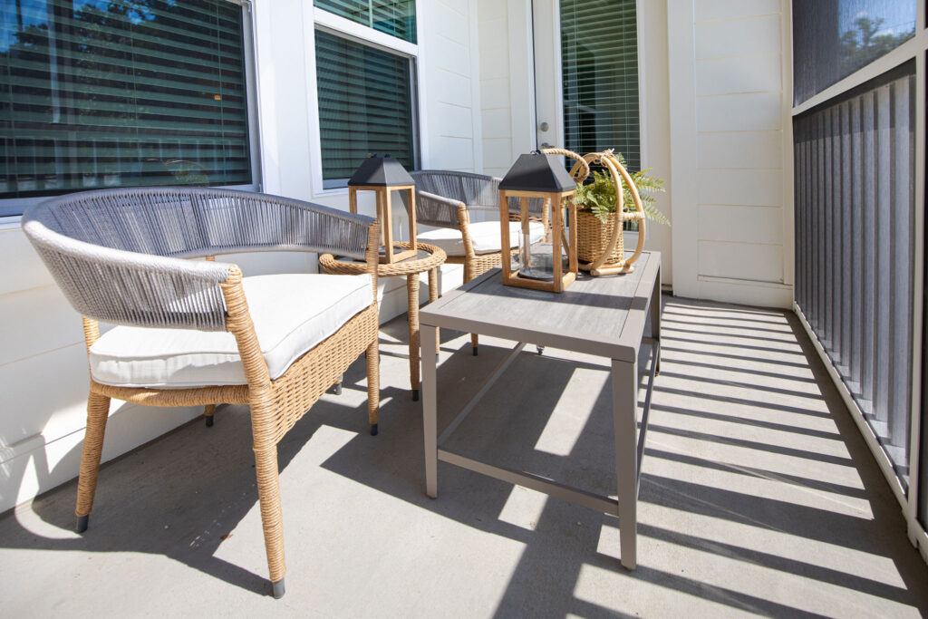 outdoor view of a unit patio with seating and decor