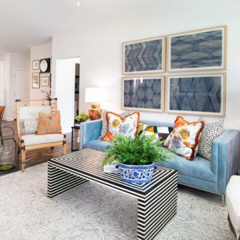 living room with couch, chairs, and decor