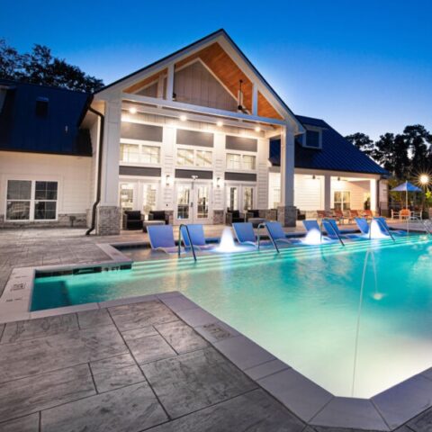 night shot of pool and clubhouse